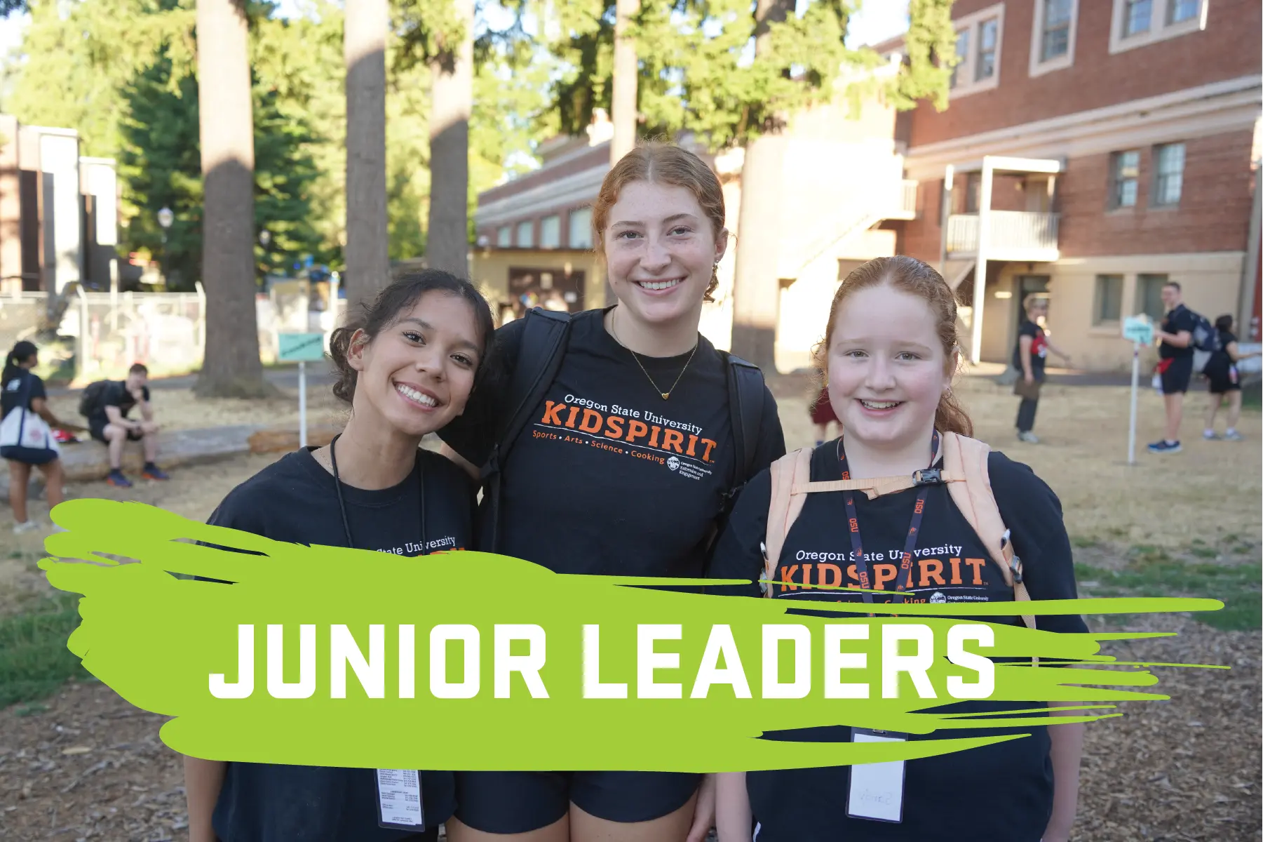 Junior leaders smiling outside