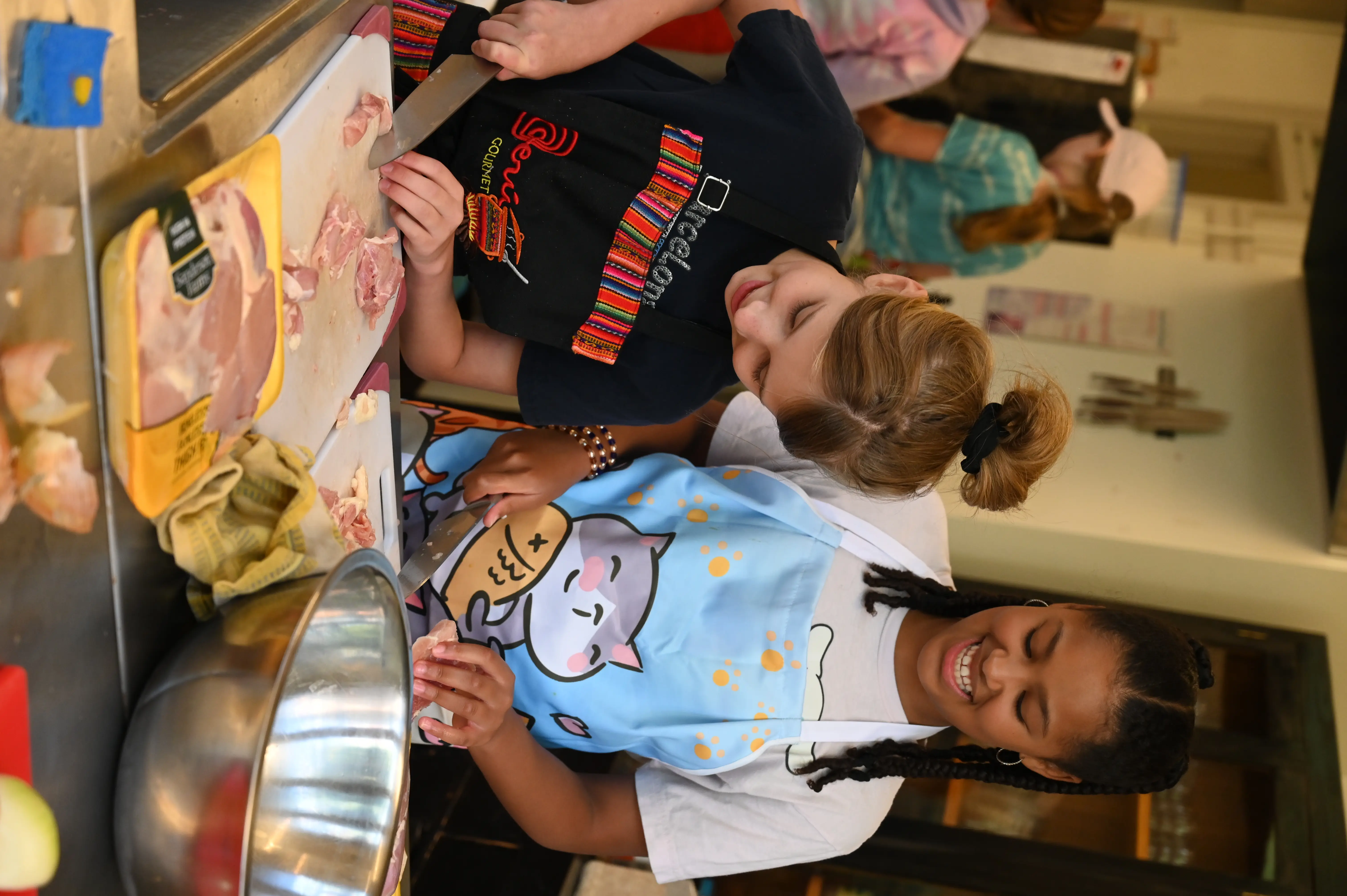 campers smile while chopping SDC 2024
