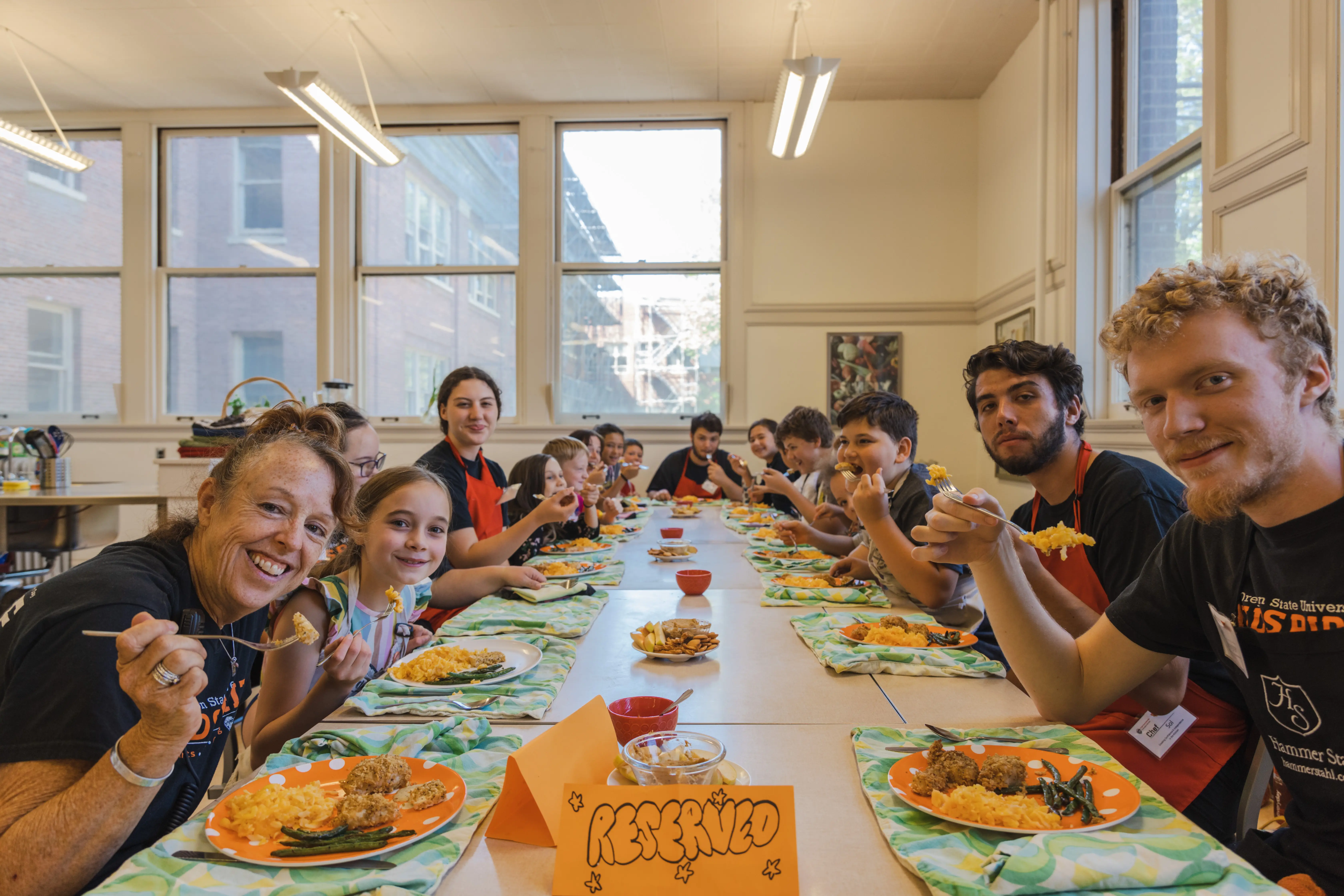 Campers and staff eating their cooking